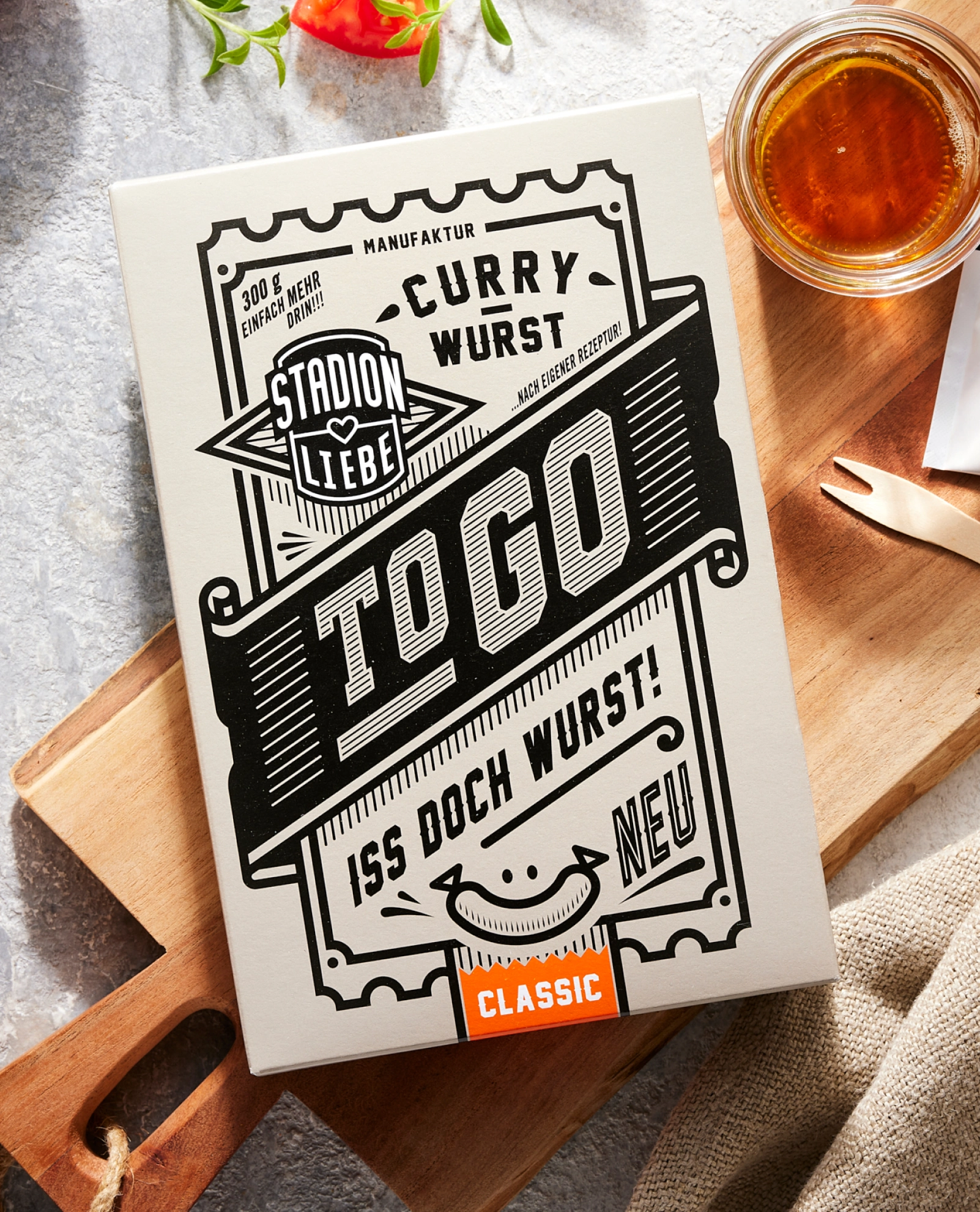 Verpackungsdesign und To-Go-Produkte des Food-Startups Stadionliebe München